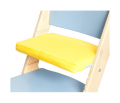 Žlutý podsedák na modré rostoucí židli Sedees